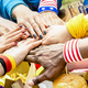 Top side view of multiracial hands of football supporter friend sharing street food - PhotoDune Item for Sale