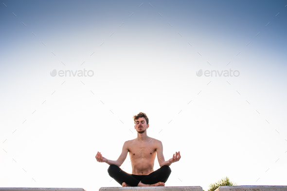 Young yoga practitioner training her pose - Stock Photo - Images