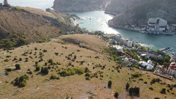 Aerial Panoramic View of Balaklava Landscape with Boats and Sea in Marina Bay on Sunset Time alt