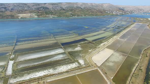 360 view of salt pans surrounded by sea and mountains of Pag island, Croatia alt