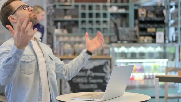 Man with Laptop Having Loss Failure alt