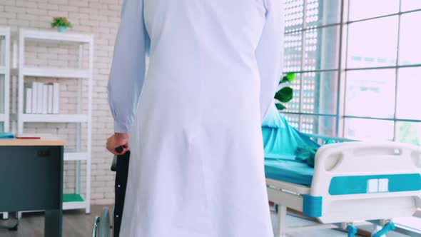 Doctor in Professional Uniform Examining Patient at Hospital alt