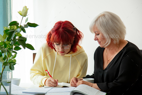 Mother with daughter preparing for the university entrance exam in Europe