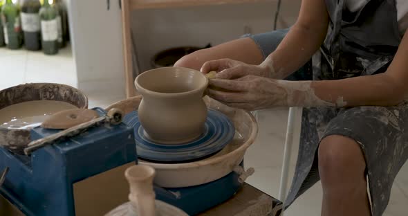 Process of Creating Clay Pot Unrecognisable Female Master Working on a Pottery Wheel in Studio