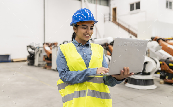 Hispanic engineer woman with computer in factory Stock Photo by ...