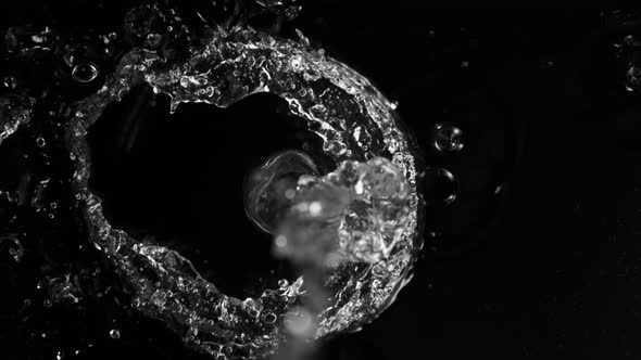Super Slow Motion Shot of Splashing Water on Black Background at 1000Fps. alt