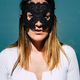 Vertical portrait of attractive young woman with black mask on her face and white shirt - PhotoDune Item for Sale