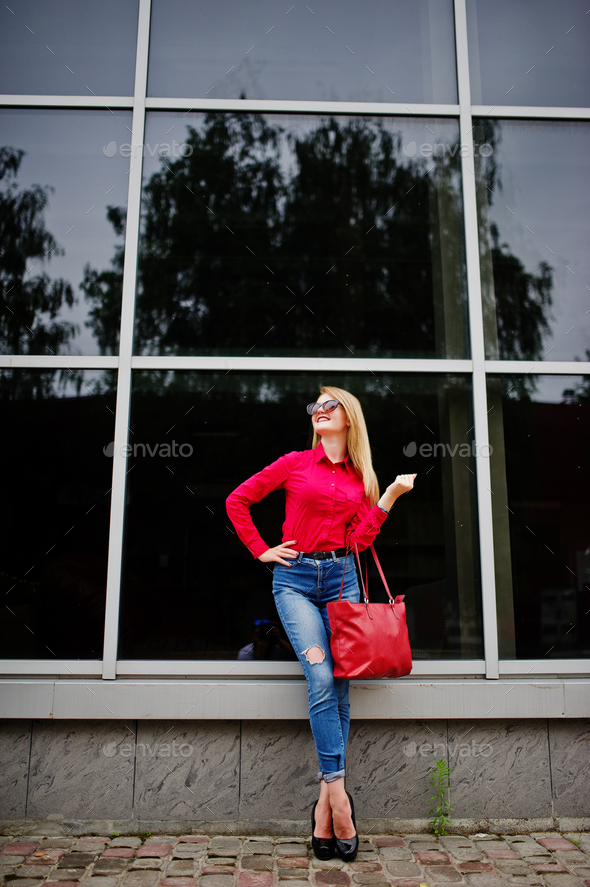 Portrait of a beautiful woman wearing red blouse