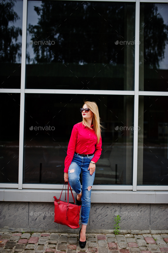 Portrait of a beautiful woman wearing red blouse