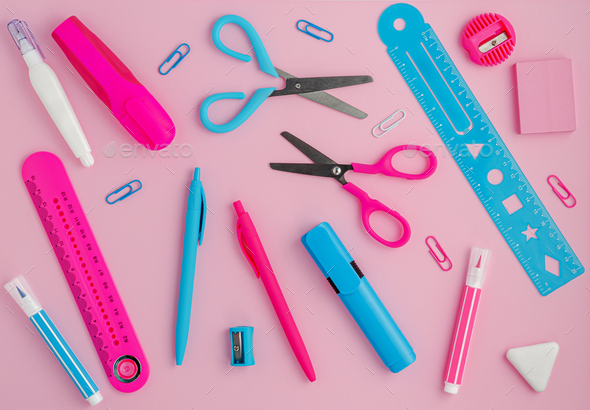 Stationery background on pink. School supplies, studying concept