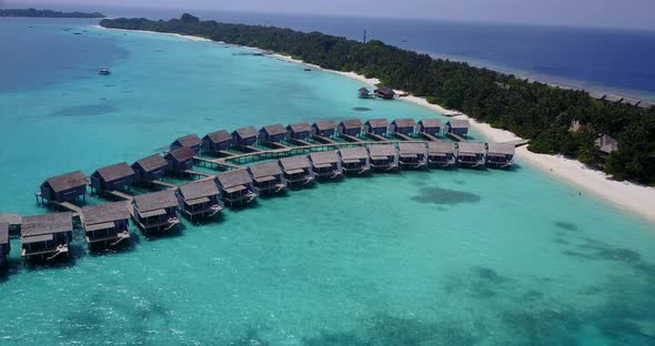 Beautiful fly over abstract shot of a sunshine white sandy paradise beach and blue sea background in alt