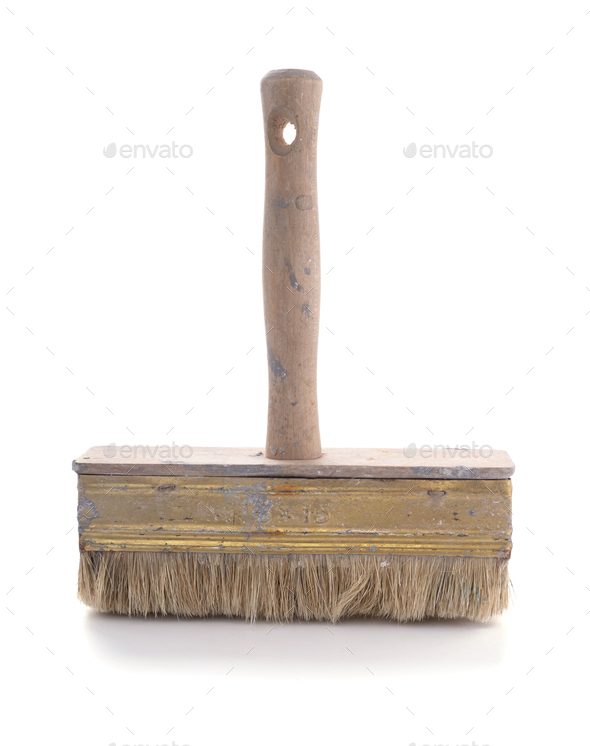 Old used paintbrush tool isolated at white background. Construction paint brush Stock Photo by