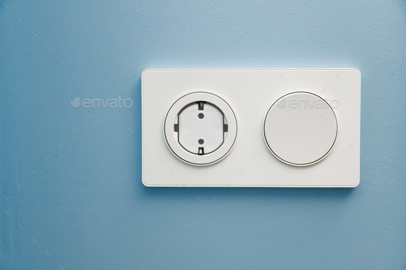 Safety plug for an electrical outlet, protecting a child from electric shock on a blue background