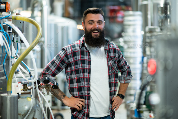 Portrait of a bearded man working in a brewery