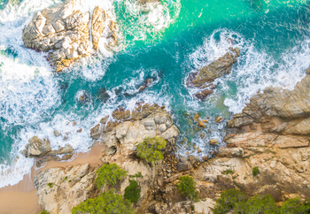 Panoramic aerial view of Beach full of rocks and waves