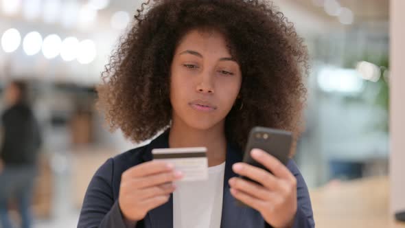 Online Payment By Young African Businesswoman on Smartphone, Success alt