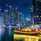 Dubai marina and traditional boat in UAE at night - PhotoDune Item for Sale