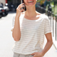 Smiling young asian woman talking with mobile phone in city - PhotoDune Item for Sale