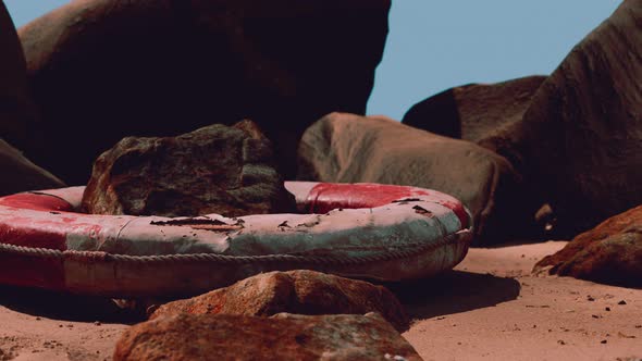 Old Life Buoy on Sand in Sunset alt