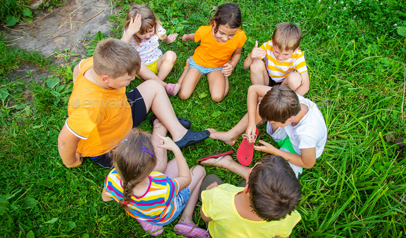 Children are playing with their hands clasped together. Selective focus ...