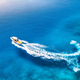 Aerial view of the speed boat in clear blue water at sunset - PhotoDune Item for Sale