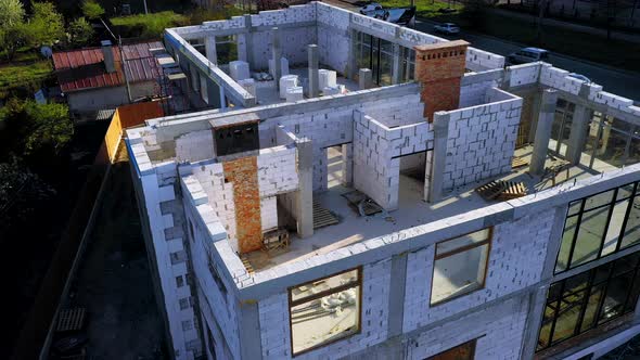 Building site of a house under construction made from white foam concrete blocks alt