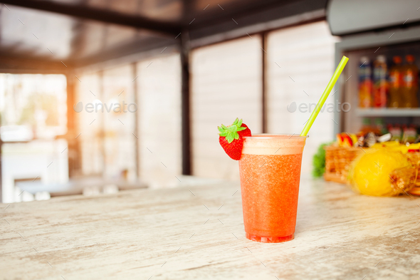 Summer refreshing drink, fruit strawberry frappe, smoothie, juice, ice and sparkling water