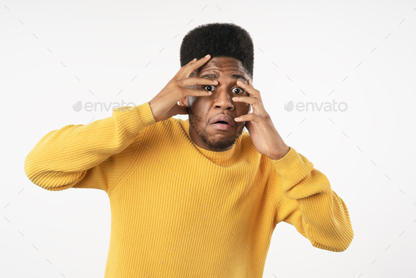 African young man fear facial expression standing isolated on white studio background