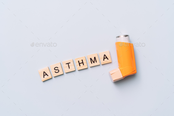 Inhalation balloon next to the word asthma - Stock Photo - Images
