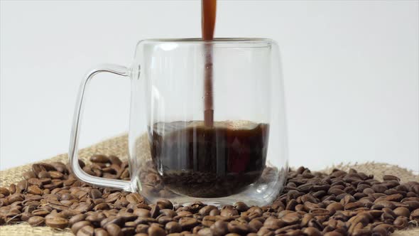 Pouring Black Coffee Into a Cup