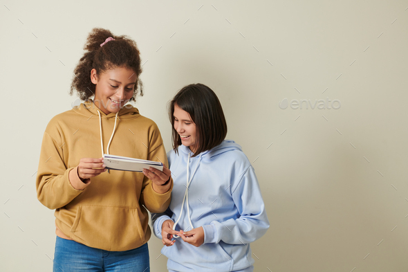Schoolgirls Reading Acceptance Letter