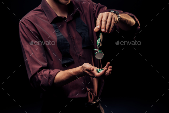 cropped view of man throwing poker chips isolated on black