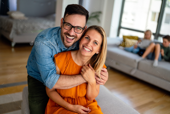Portrait of loving couple hugging each other and spending romantic time together - Stock Photo - Images