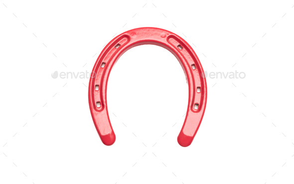 Horseshoe isolated cutout on white background. Red color horse shoe, good luck and fortune symbol