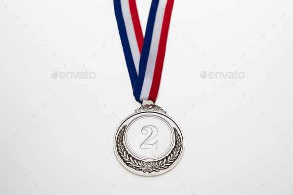 Silver medal. Champion trophy award and ribbon. Prize in sport for second place isolated on white