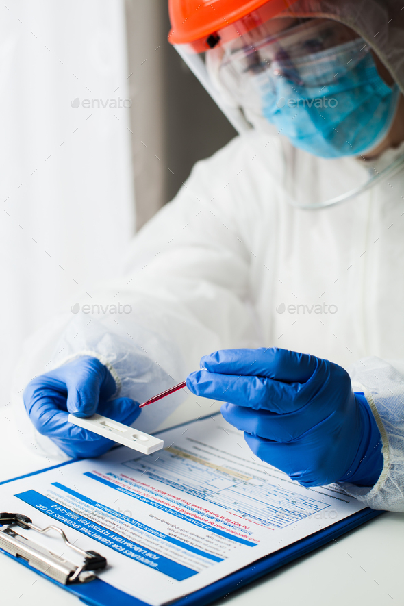 Lab technician medical scientist performing Coronavirus rapid diagnostic testing