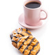 Chip cookies with peanuts and chocolate strips and coffee cup isolated on white background. - PhotoDune Item for Sale