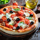 Delicious and fresh pizza Capricciosa with prosciutto, mushrooms and cheese. - PhotoDune Item for Sale
