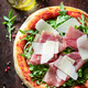 Tasty and healthy pizza Parma with prosciutto, parmesan and arugula. - PhotoDune Item for Sale