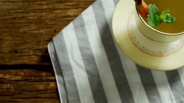 Herbal tea with cinnamon sticks and herb on a cloth 4k alt