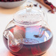 Red tea karkade or hibiscus in glass tea pot and on plate, vertical - PhotoDune Item for Sale