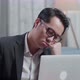 Asian Businessman In Jacket And Shorts Holding His Cheek And Sleeping While Working With A Laptop - VideoHive Item for Sale