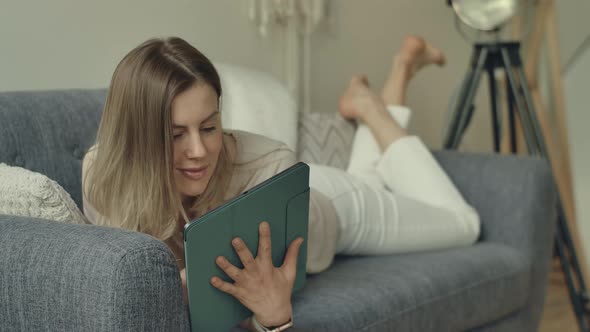 Woman Liyng Down with Tablet