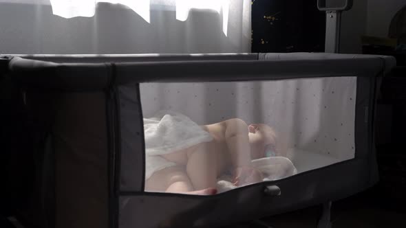 General Plan of Newborn Nnaked Sleeping Little Small Infant Baby Boy Lying On Side On Soft White alt