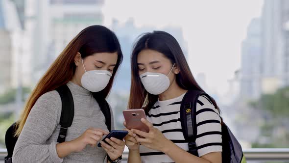 Asian teenager travelers wearing protective mask
