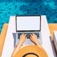 Young woman freelancer traveler working online using laptop while traveling on summer vacation - PhotoDune Item for Sale