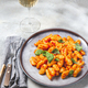 Traditional Italian potato Gnocchi with tomato sauce and fresh basil on gray plate - PhotoDune Item for Sale