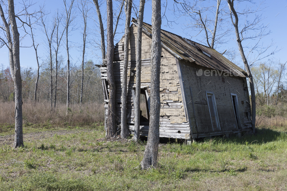 Abandoned homestead, a small log cabin, a building leaning to the side. - Stock Photo - Images