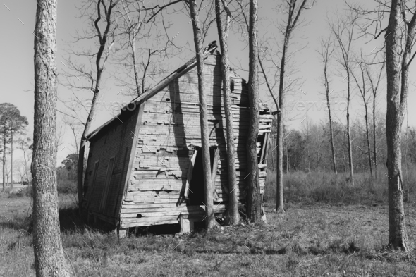 Abandoned homestead, a small log cabin, a building leaning to the side - Stock Photo - Images
