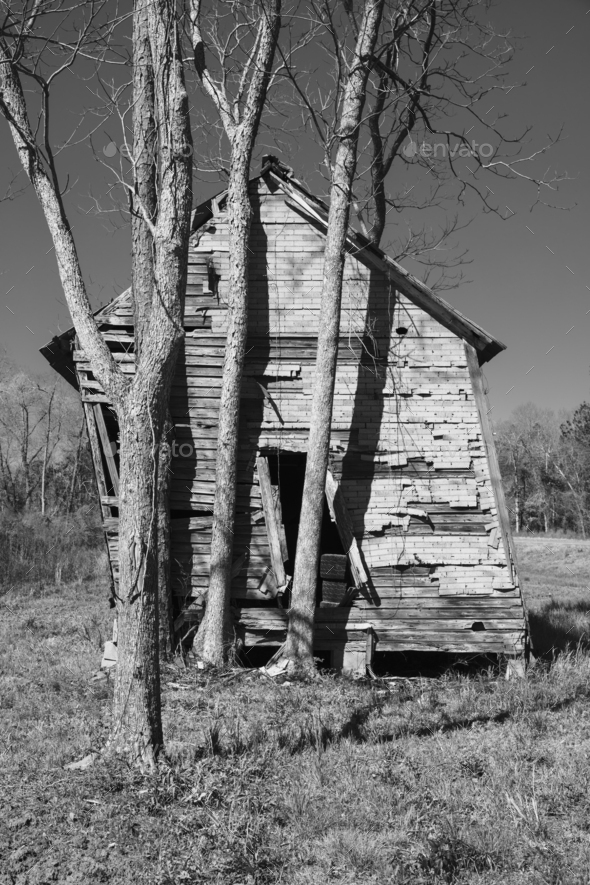Abandoned homestead wooden building leaning, unstable and collapsing. - Stock Photo - Images